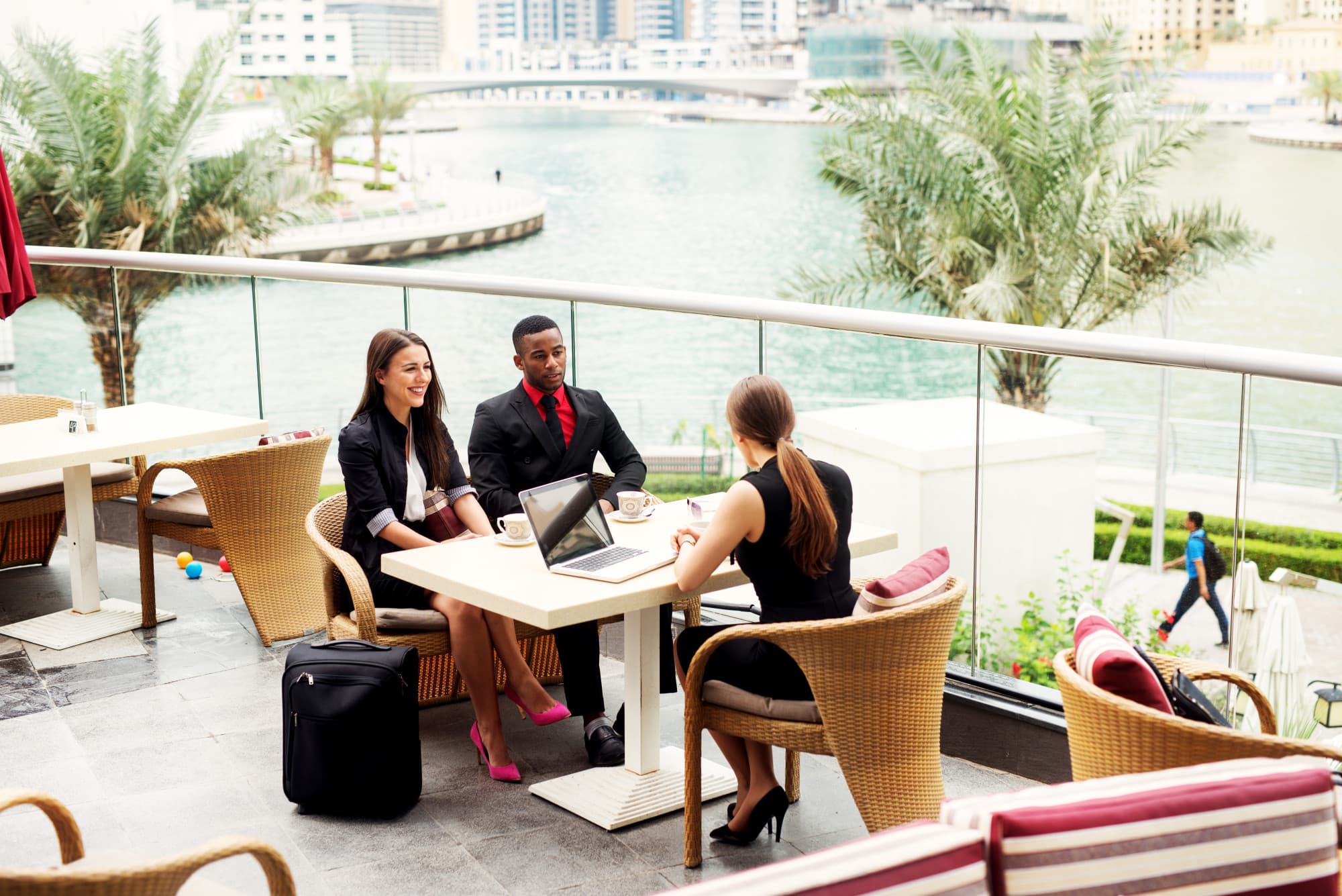 Professional real estate agent meeting with clients in Dubai luxury office